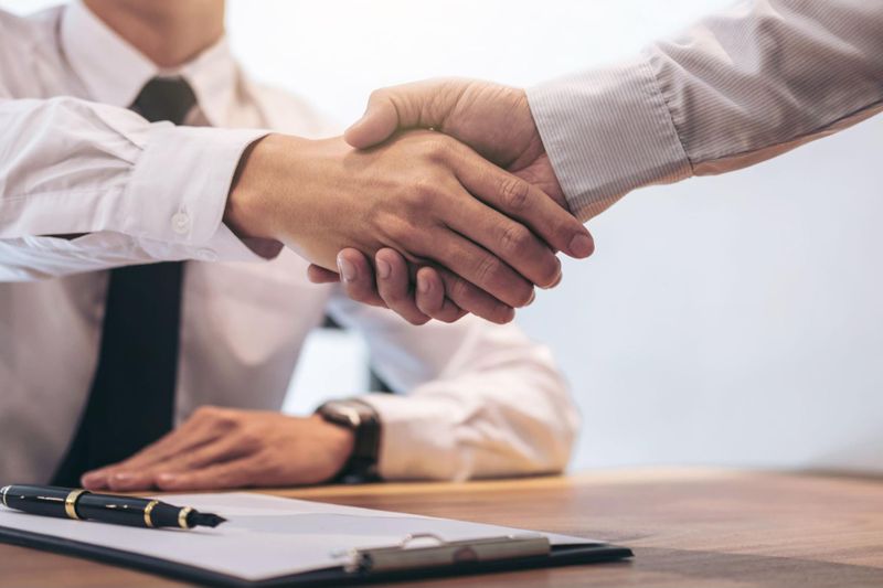 New adult website investor shaking hands with adult site broker
