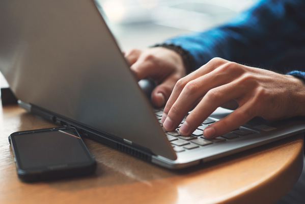 Client searching for tube site on laptop