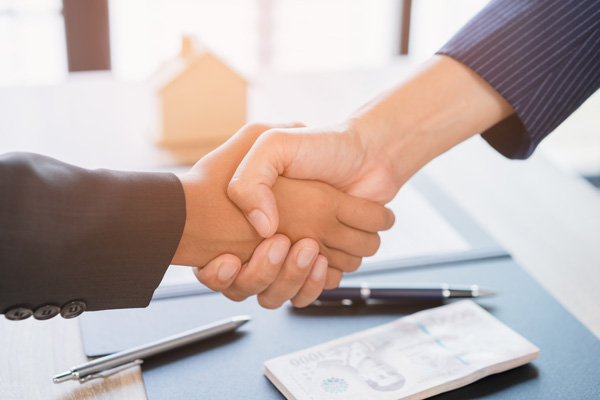 Closing a deal on online dating site with handshake