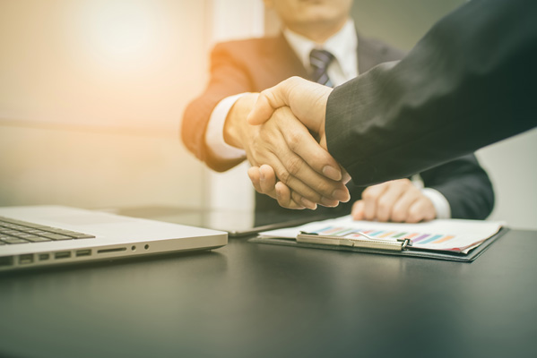 Adult industry professionals shaking hands