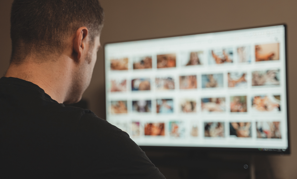 Man browsing porn site late at night