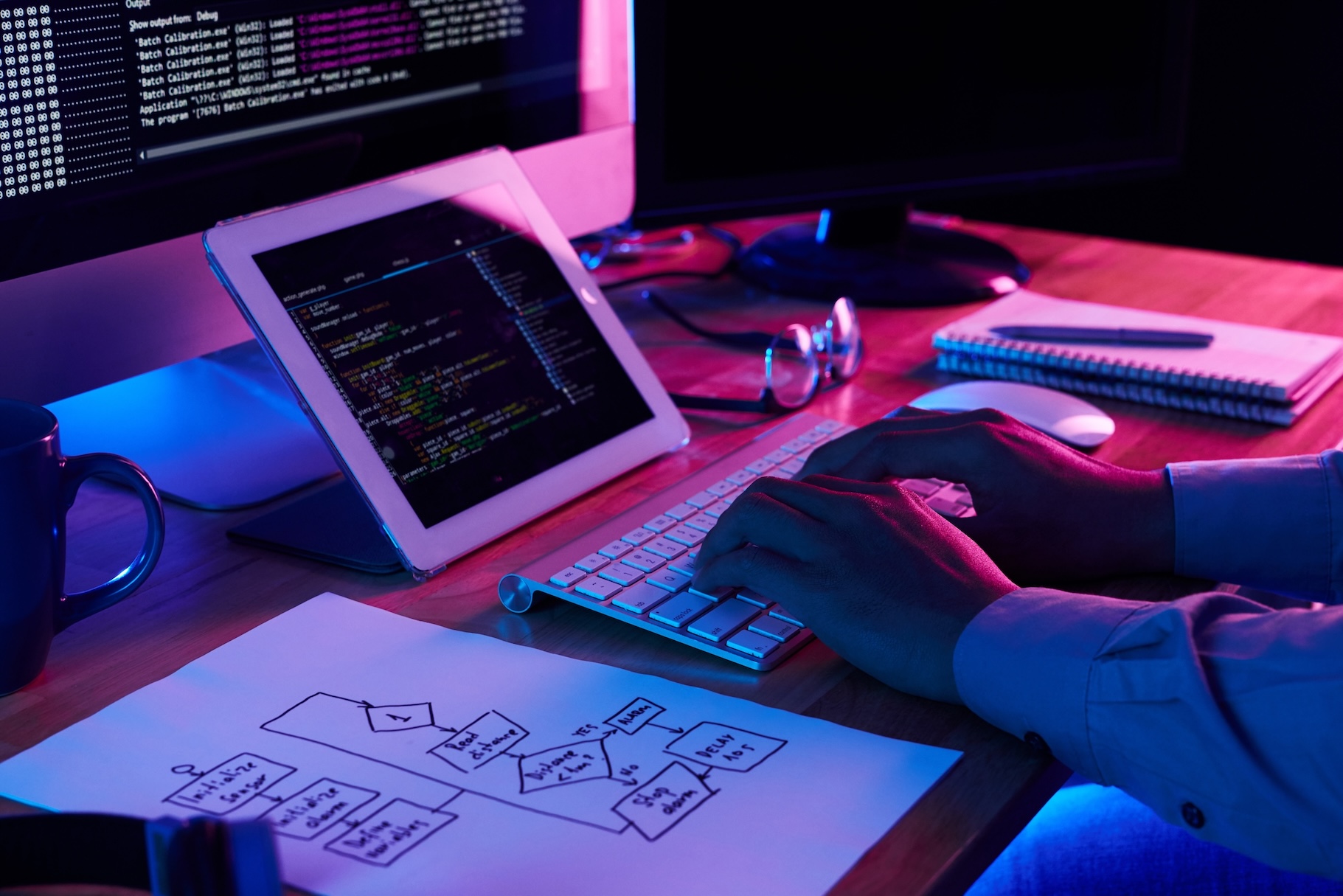 A web developer typing on a keyboard