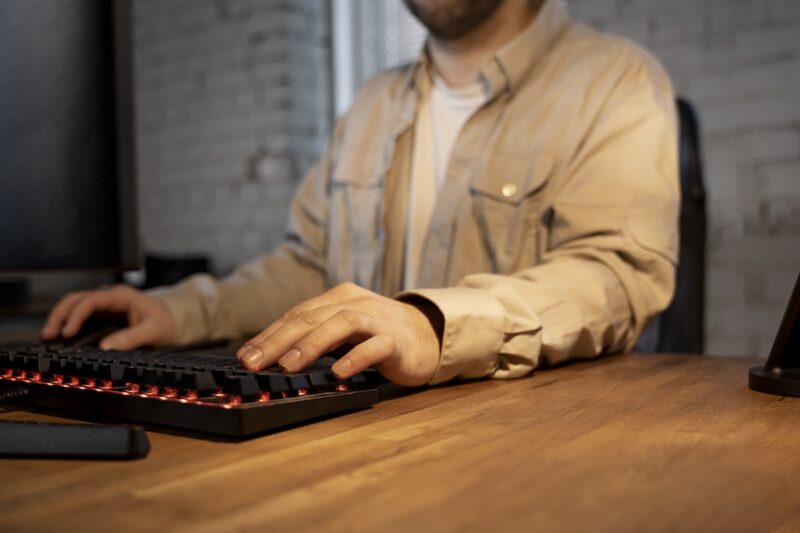 Man with his hands on a keyboard.