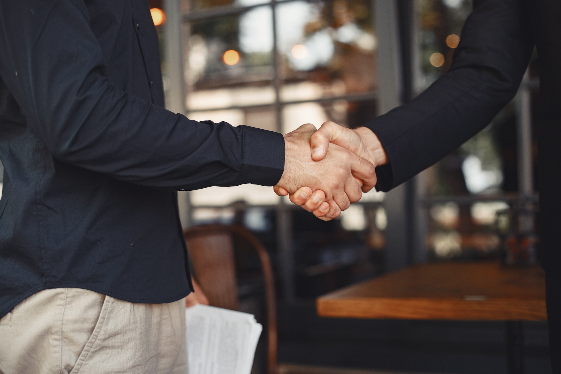 Two men shaking hands.