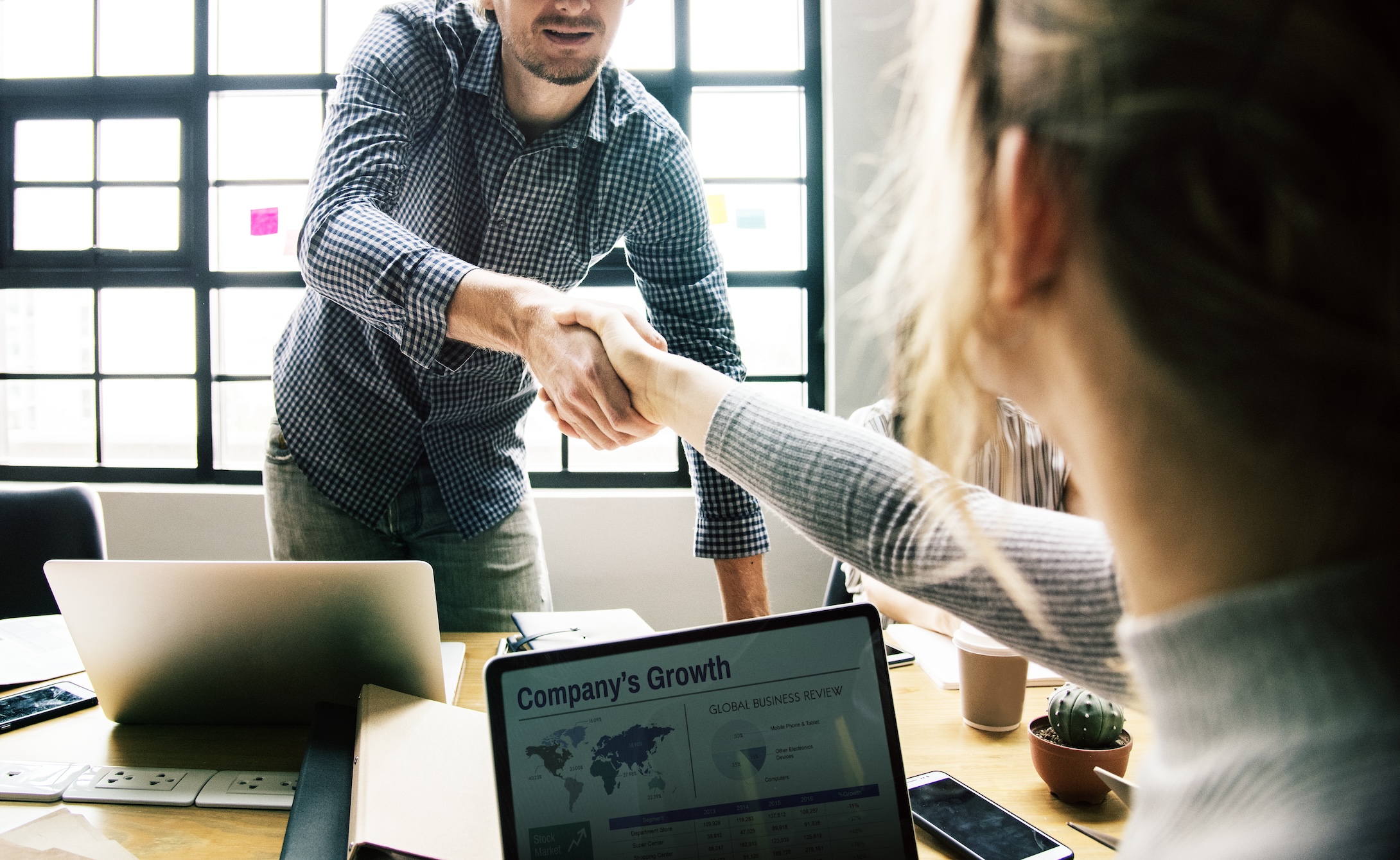 Business people shaking hands in agreement